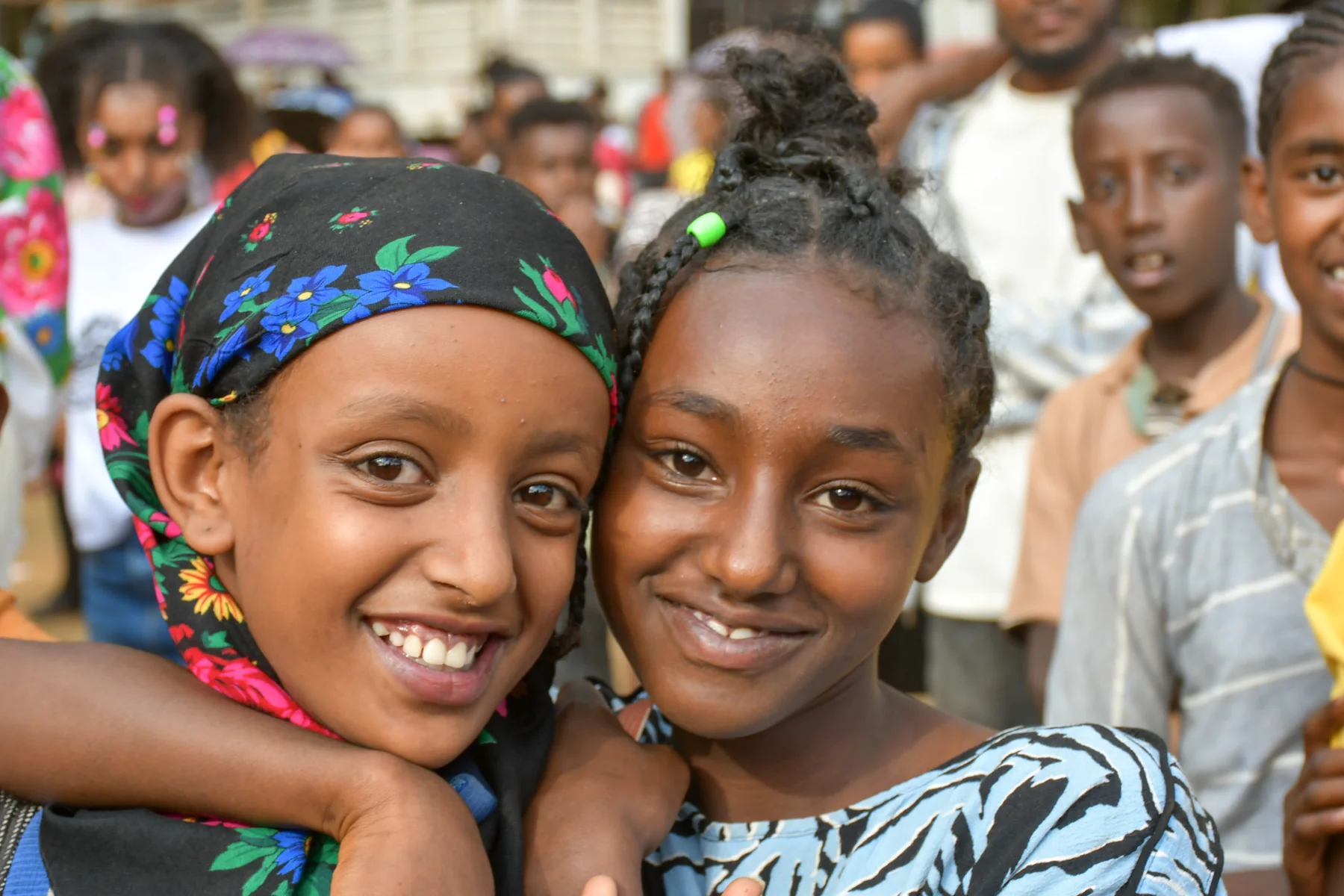Two girls smiling together