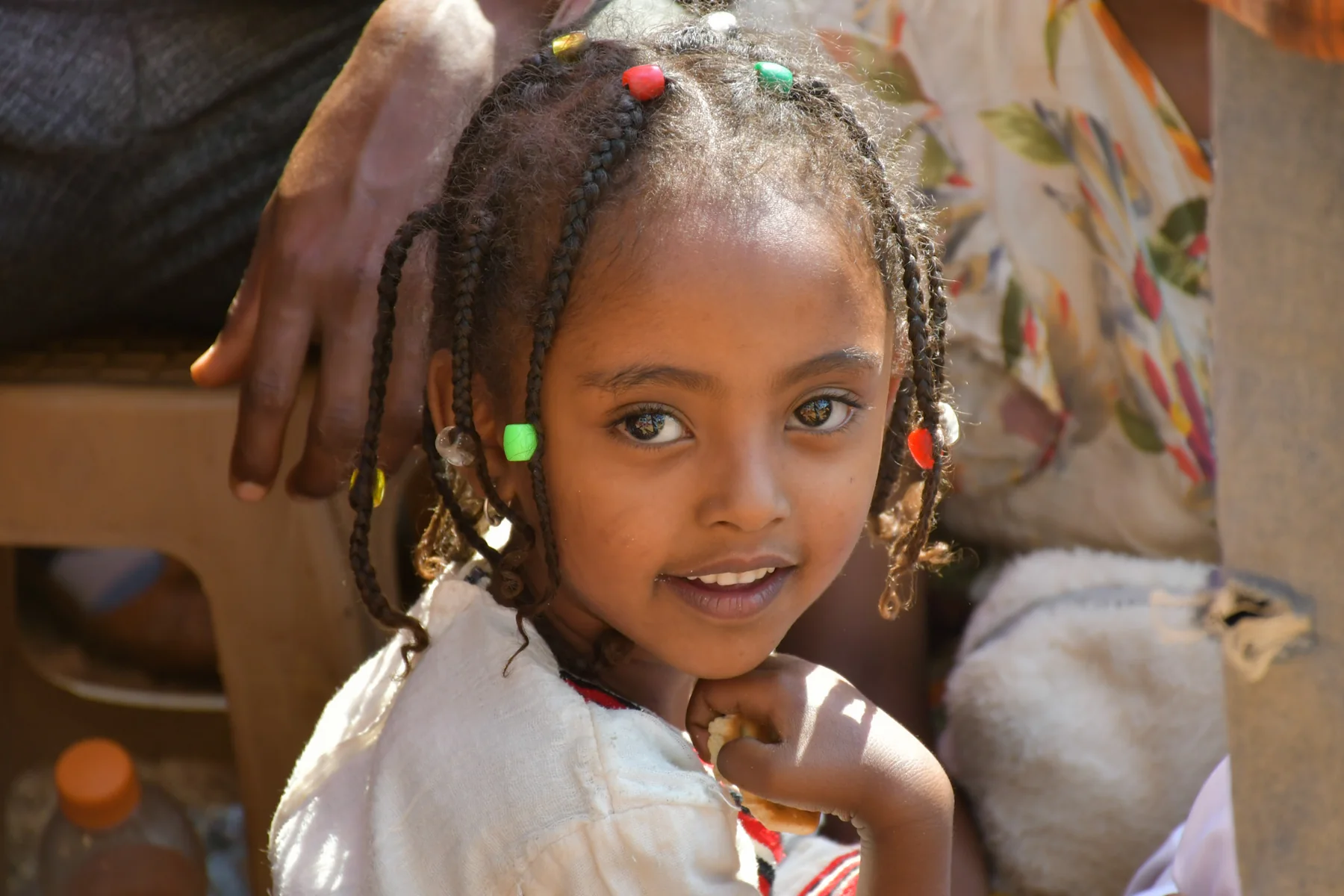 Young girl smiling at a Gospel gathering