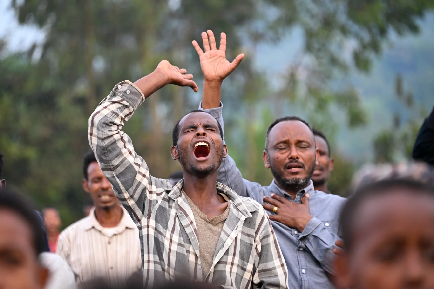 People praying at a Gospel gathering