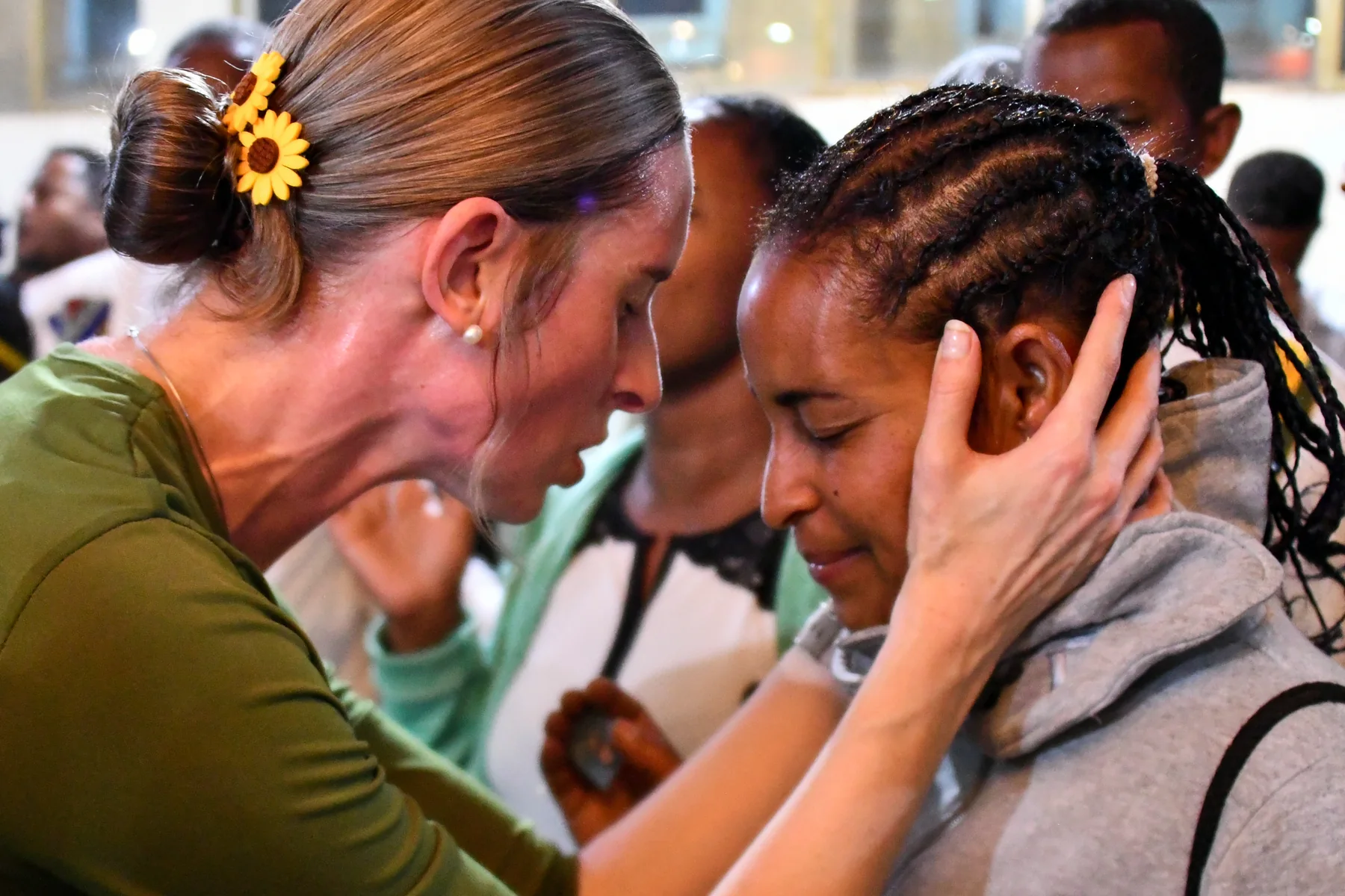 Tamryn praying with a woman